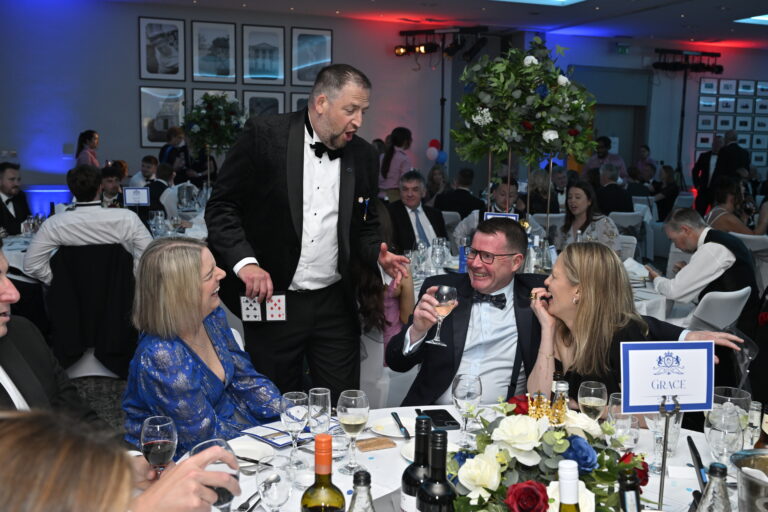 Jason performing magic at a corporate event