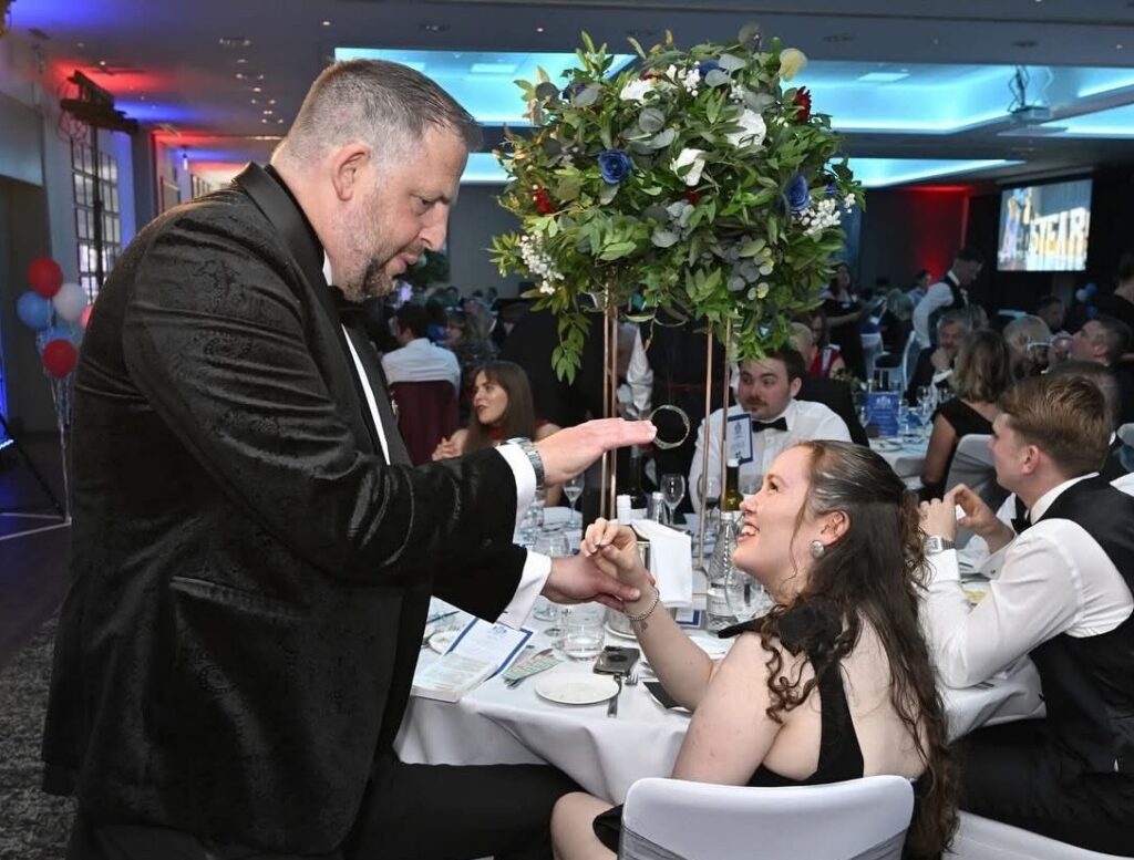 Jason entertaining at wedding with magic