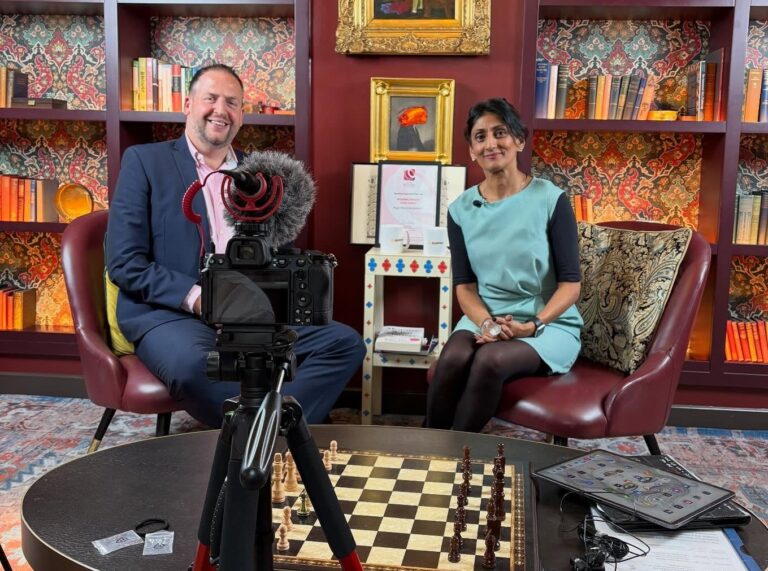 Jason at a fireside interview for Peter Jones Foundation